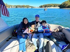 family on boat with Lekotek and Freedom Waters